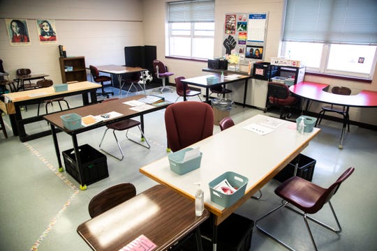 This special education classroom at City High School in Iowa City, Iowa, is set up for in-person learning amid the coronavirus pandemic. Tables have been spaced out from one another for social distancing and are marked with tape on the floor. Students are also given individual bins with disinfected supplies.