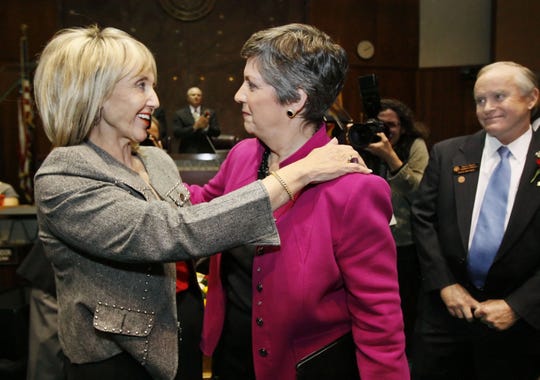 Jan Brewer, then the Secretary of State, hugs outgoing Governor Janet Napolitano after the governor gave her final State of the State address in 2009.