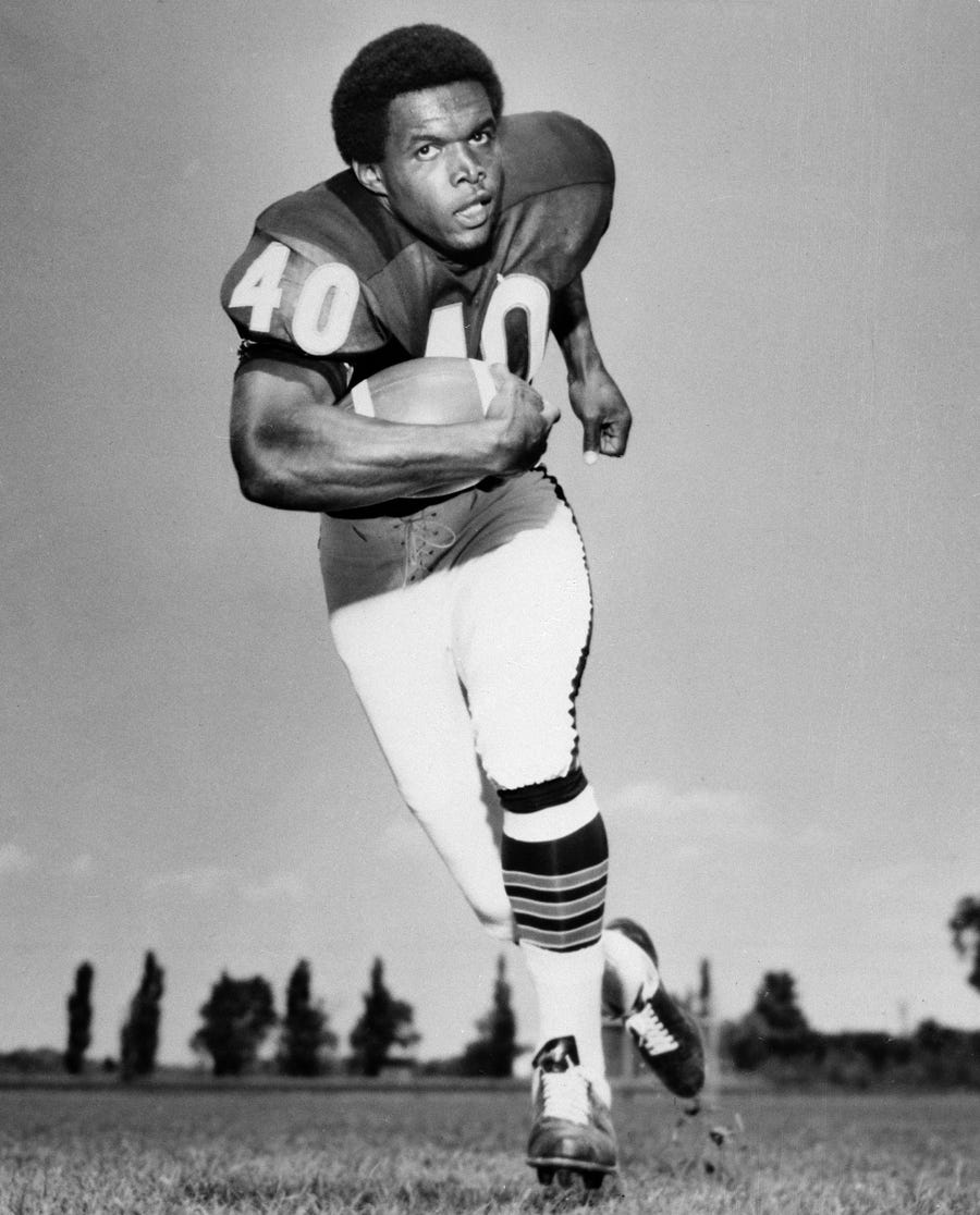 In this Sept. 1968, file photo, Chicago Bears' halfback Gale Sayers runs with the ball.