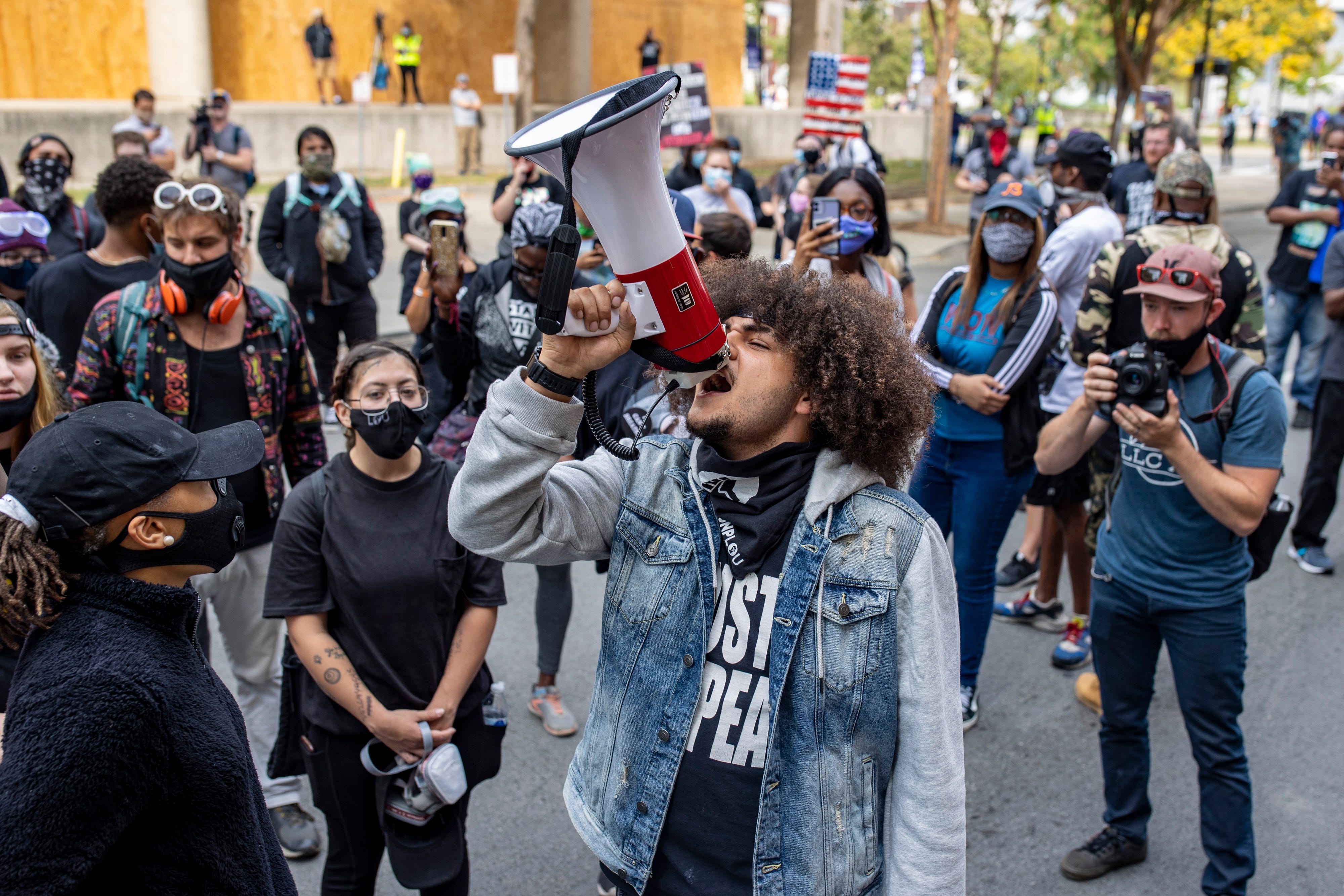 Travis Nagdy leads chants for the release of fellow protesters and 502 Livestreamers outside Metro Corrections on Thursday afternoon. 127 protesters were arrested Wednesday during protests following the announcement of the grand jury's decision in the Breonna Taylor case. Sept. 24, 2020