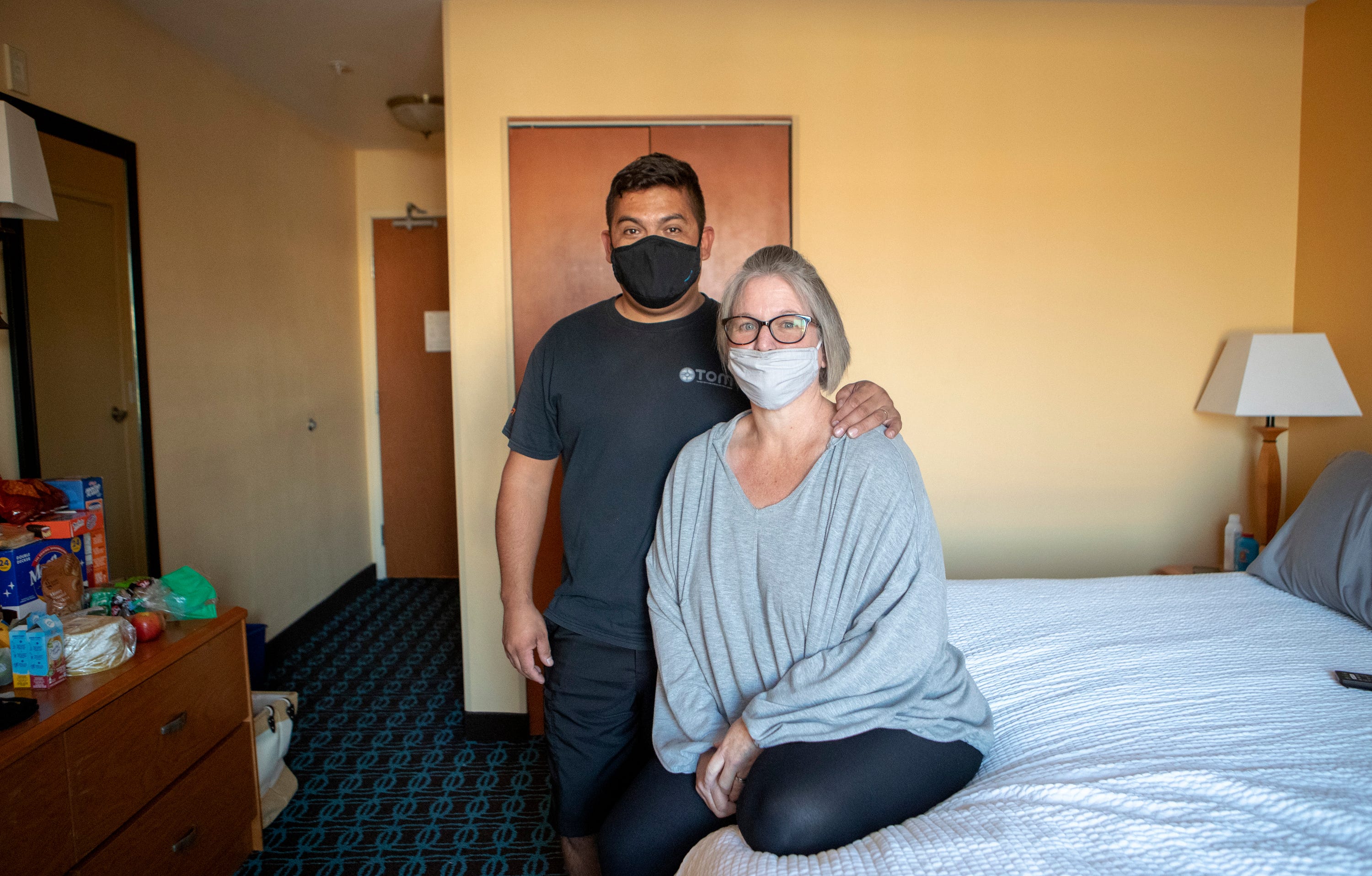 Evacuees from the El Dorado fire, Malissa and Joaquin Lopez, are photographed inside the San Bernardino, Calif., hotel they've been staying in for two weeks on September 22, 2020. The couple had just bought a new home in the Angelus Oaks area only four weeks before the fire broke out.