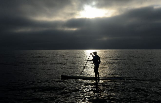 Rich Haggerty, 54, of Ventura  paddles from Anacapa Island to Channel Islands Harbor on Wednesday, Sept. 23, 2020. He did the paddle with his two friends Enrique Lopez, 67, of Ventura, and Doug Macaulay, 62, of Oakhurst. The trip was a dream for Haggerty, who was grateful for the opportunity after a near-fatal mountain biking crash last year.