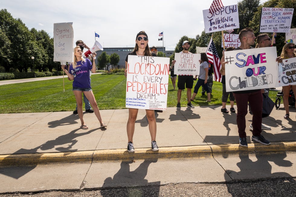 People march during a "Save the Children" rally outside the Capitol on Aug. 22 in St. Paul, Minn. Some of the hundreds of rallies around the country decrying human trafficking and pedophilia were linked to social media accounts promoting the QAnon conspiracy.