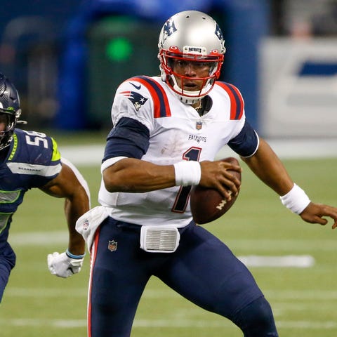 New England Patriots quarterback Cam Newton (1) ru