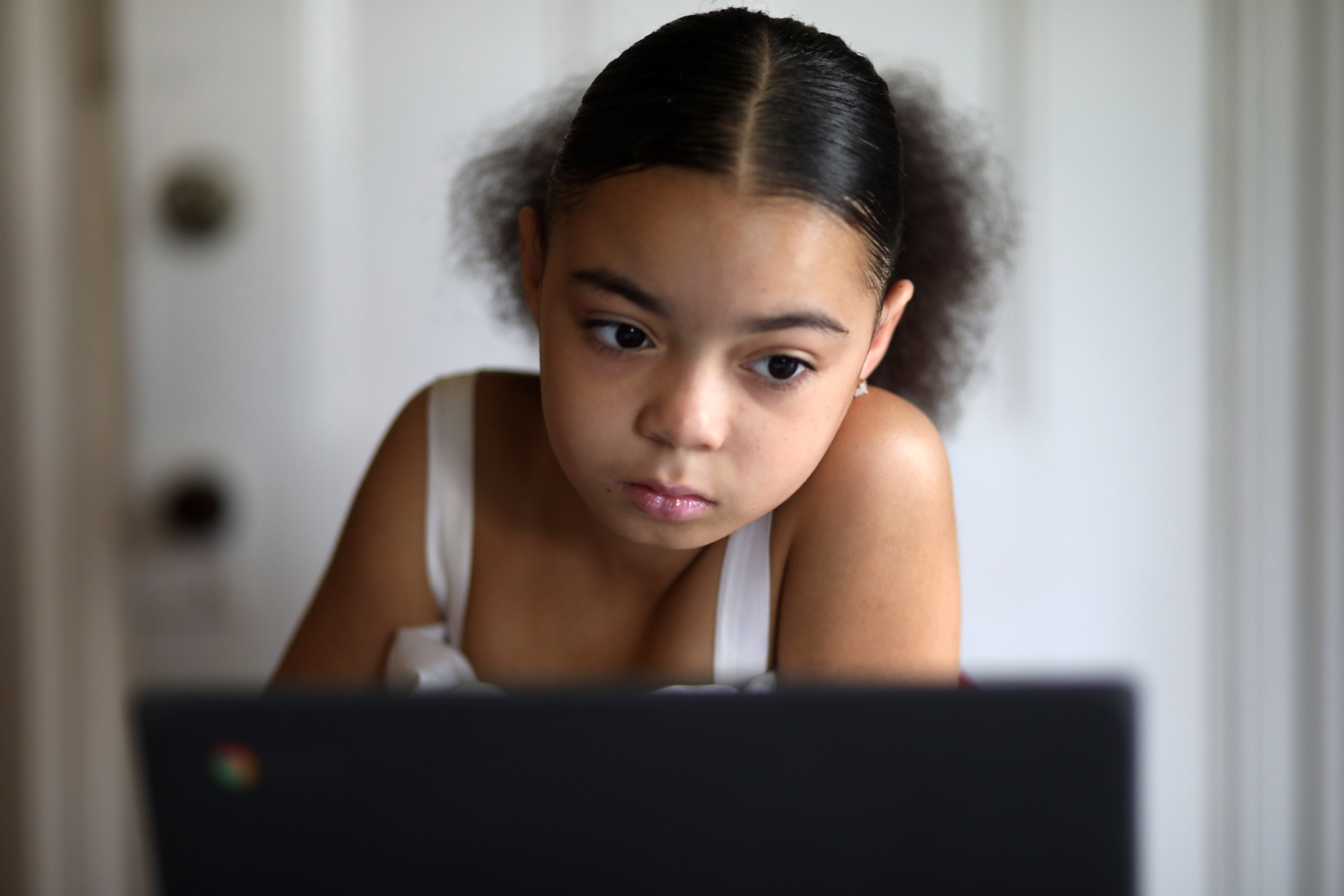 Diamond Yeno reviews her school work on Sept. 24, 2020. Yeno, 8, is a fourth grade student at Morse Elementary School in Poughkeepsie.