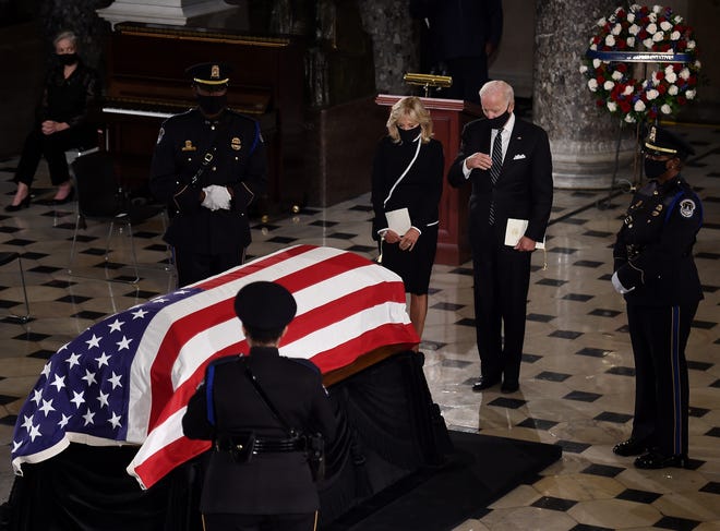 WASHINGTON, DC - SEPTEMBER 25: Democratic presidential nominee Joe Biden and his wife Dr. Jill Biden pay their respects to the late Associate Justice Ruth Bader Ginsburg as her casket lies in state during a memorial service in her honor in the Statuary Hall of the US Capitol, on September 25, 2020 in Washington, DC. Ginsburg, who was appointed by former U.S. President Bill Clinton, served on the high court from 1993, until her death on September 18, 2020. She is the first woman to lie in state at the Capitol.