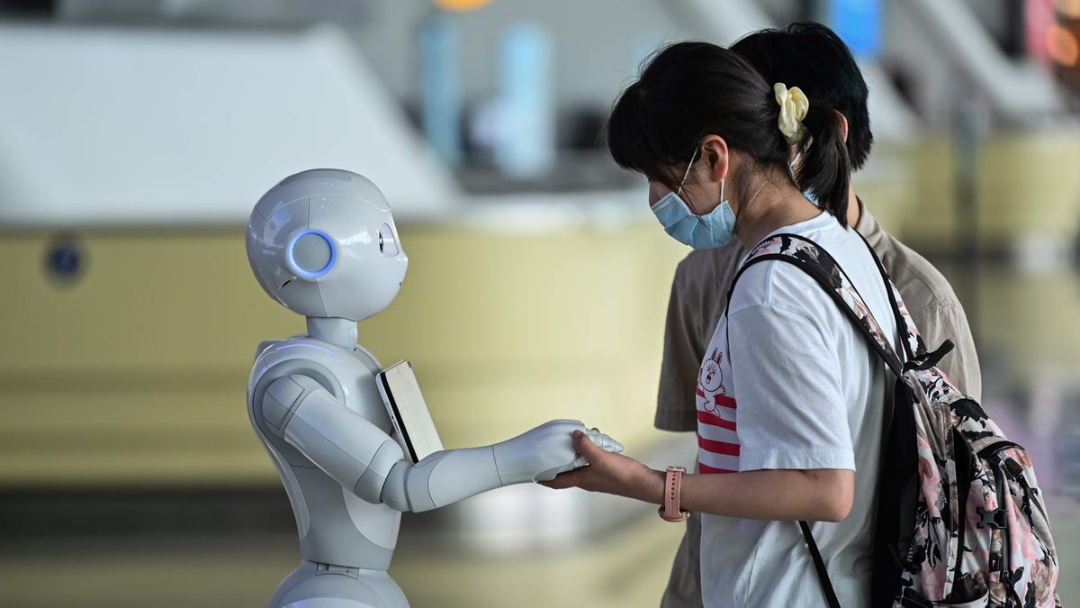 Robots roam airports reminding passengers to put their masks on.