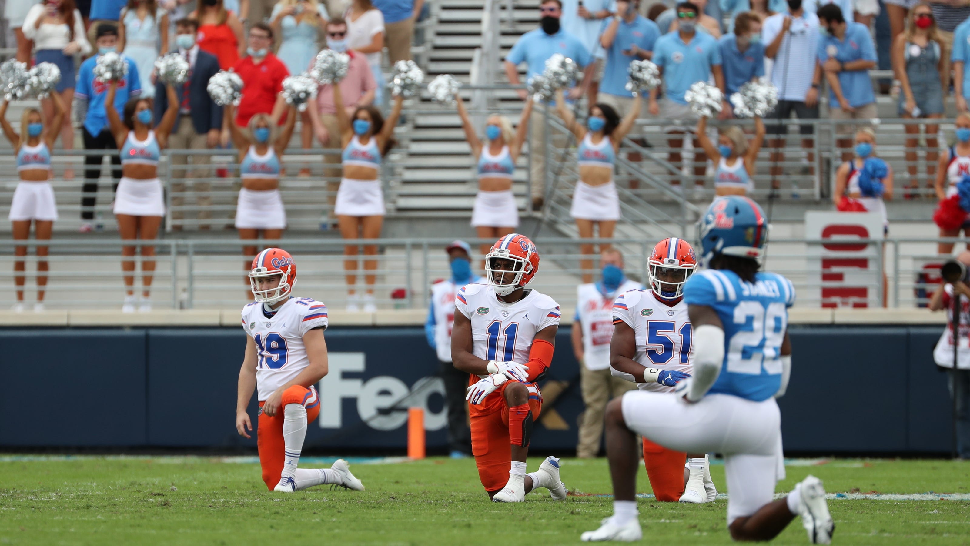Ole Miss, Florida players kneel before college football kickoff