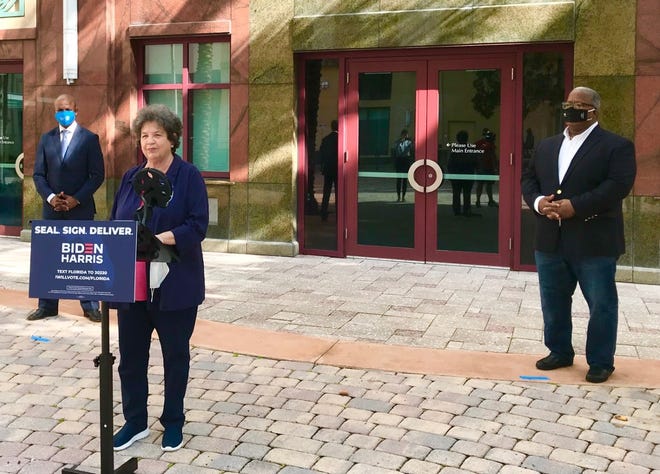 Congresswoman Lois Frankel at West Palm Beach City Hall, flanked by County Commissioner Mack Bernard, left, and West Palm Mayor Keith James.