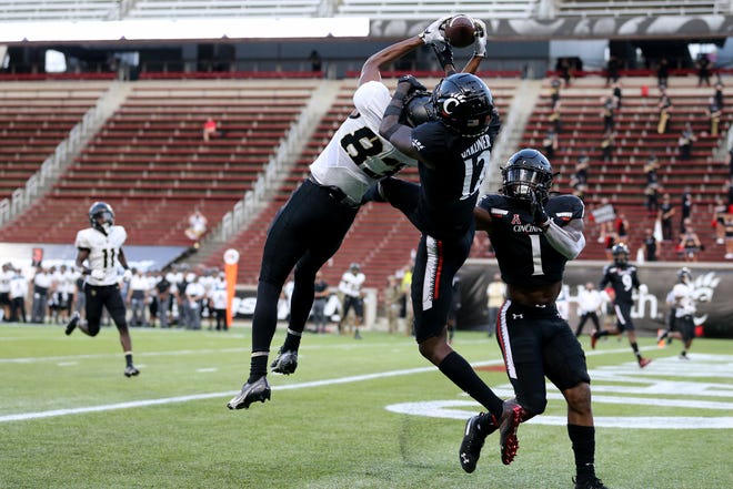 Cincinnati Bearcats cornerback Ahmad Gardner (12) defends a pass intended for Army Black Knights wide receiver Reikan Donaldson (83) in the end zone in the fourth quarter during an NCAA college football game, Saturday, Sept. 26, 2020, at Nippert Stadium in Cincinnati. The Cincinnati Bearcats won 24-10.