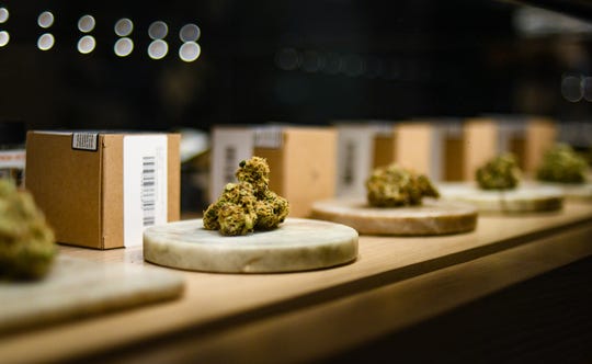 A cabinet of different types of marijuana buds is available from Pleasantrees in East Lansing, the city's first and so far only East Lansing facility to be licensed by the state for recreational and medical retailers.  This burden is 