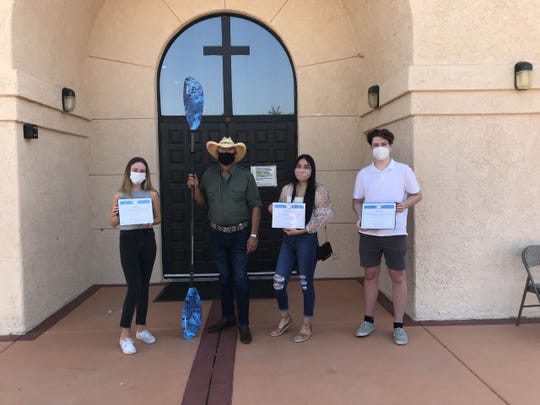 Students Evalyn Garcia, Layton Jones and Clay Jones pose with Riverside County Supervisor V. Manuel Perez. The three students plan to paddle across the Salton Sea on Aug. 26, 2020.