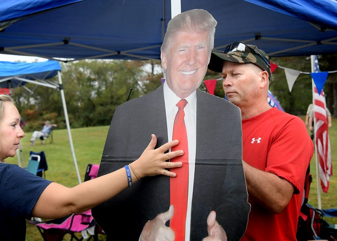 Lauren and Neil Bollinger of West Manheim Township affix a life-sized image of Donald J. Trump to their pop-up tent during a Boaters & Voters for Trump rally at Codorus State Park Saturday, Sept. 26, 2020. The event featured about 15 boats on the park's Lake Marburg, displaying pro-Trump flags and signs. About 150 people attended the event. Bill Kalina photo