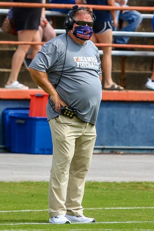 Escambia head coach Mike Bennett looks on as his team takes on West Florida Tech on Saturday, Sept. 26, 2020, during the season-opening game at Escambia High School. The Gators won 24-20.