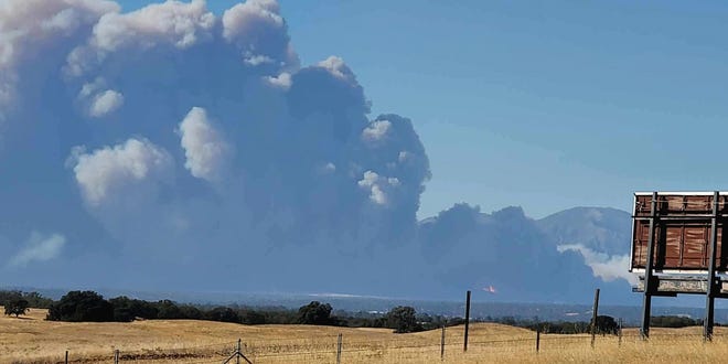 The Zogg Fire sent up a huge plume Sunday afternoon, Sept. 27, 2020, after starting in Igo.