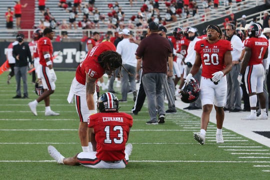 Texas Tech Red Raiders wide receiver Erik Ezukanma (13) and defensive back Travis Koontz (16) react after the game against the Texas Longhorns at Jones AT&T Stadium.