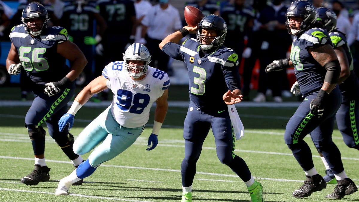 Russell Wilson #3 of the Seattle Seahawks looks to pass against the Dallas Cowboys during the second quarter in the game at CenturyLink Field on September 27, 2020 in Seattle, Washington.