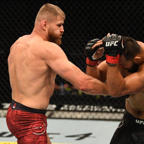 Jan Blachowicz opunches Dominick Reyes during UFC 