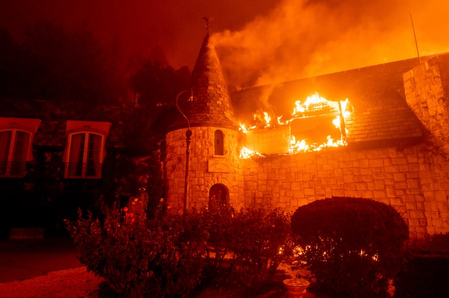 Flames from the Glass Fire consume Chateau Boswell Winery in St. Helena, Calif., on Sept. 27.