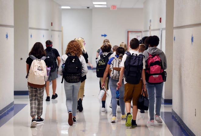 All students and faculty at Florida's Stuart Middle School must wear masks and undergo temperature checks.