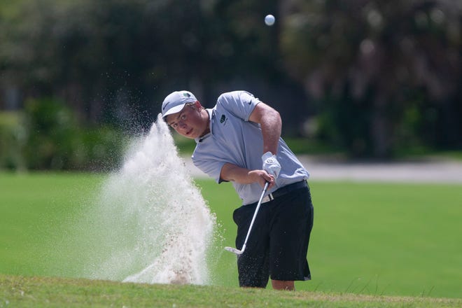 Palmetto Ridge's Ty Kaufman hits his ball out of the bunker during the Collier County Athletic Conference boys golf tournament, Tuesday, Sept. 29, 2020, at the Valencia Golf & Country Club. 