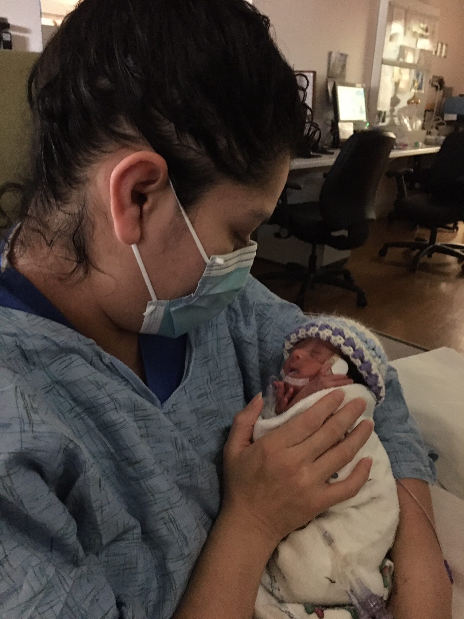 On May 11, 2020, Cyndi Nava holds her daughter, Ellie Camacho, for the first time since giving birth to her on April 19, 2020.