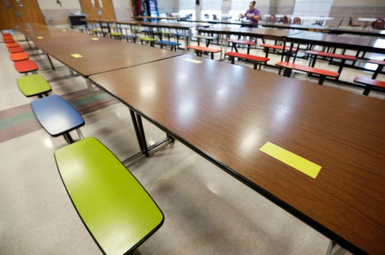 Tables in the cafeteria at Fair Grove schools have every other seat marked off to encourage social distancing due to COVID-19.