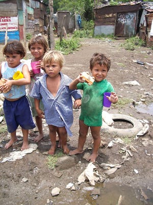 Children in the slums of Nicaragua hold up toys made and distributed by the Happy Factory. Community members are invited to see how the Cedar City non-profit has produced and distributed nearly two million toys to needy children around the world.