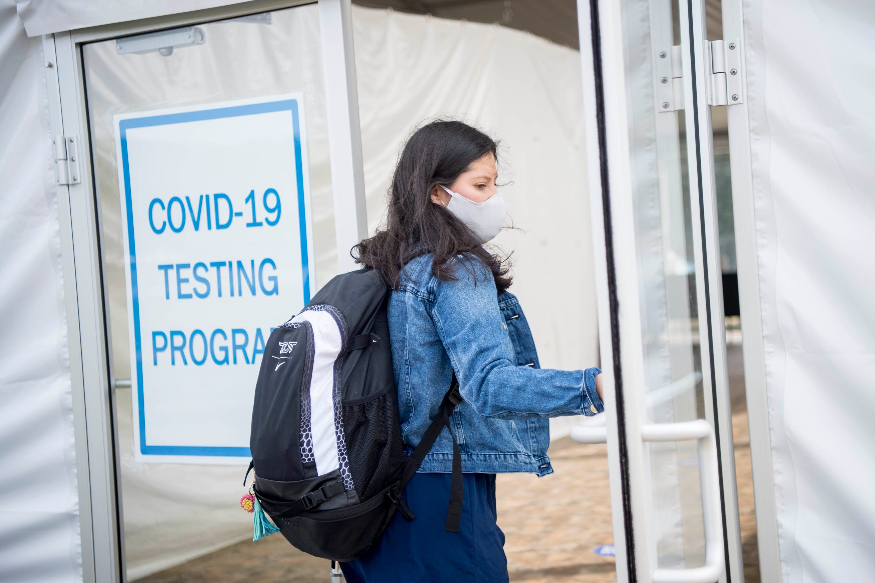 Colby College senior Ashlee Guevara, 21, of Houston, enters the COVID-19 testing site last week on campus.