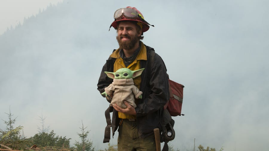 A 5-year-old donated a Baby Yoda doll to firefighters battling multiple wildfires in the Pacific Northwest to thank them for keeping everyone safe.