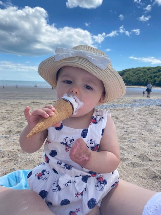 Phoebe Moon eating an ice cream cone.