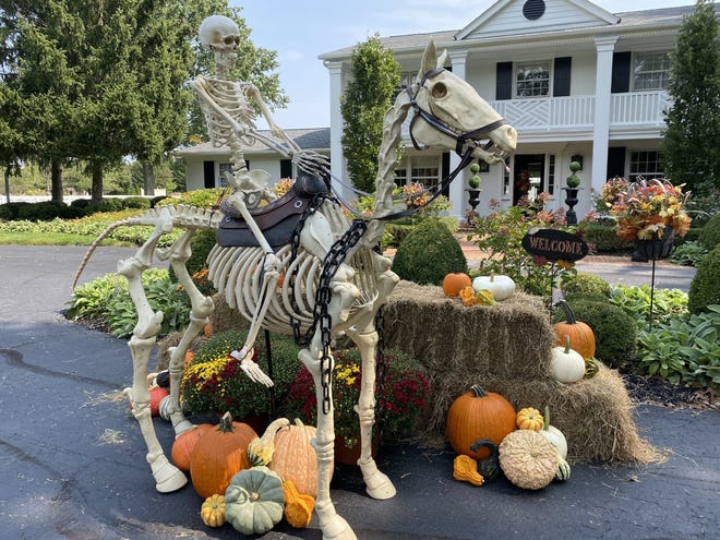 Ride 'em, cowbones! Carroll Bowman's display is quite appropriate outside her Blacklick horse farm.