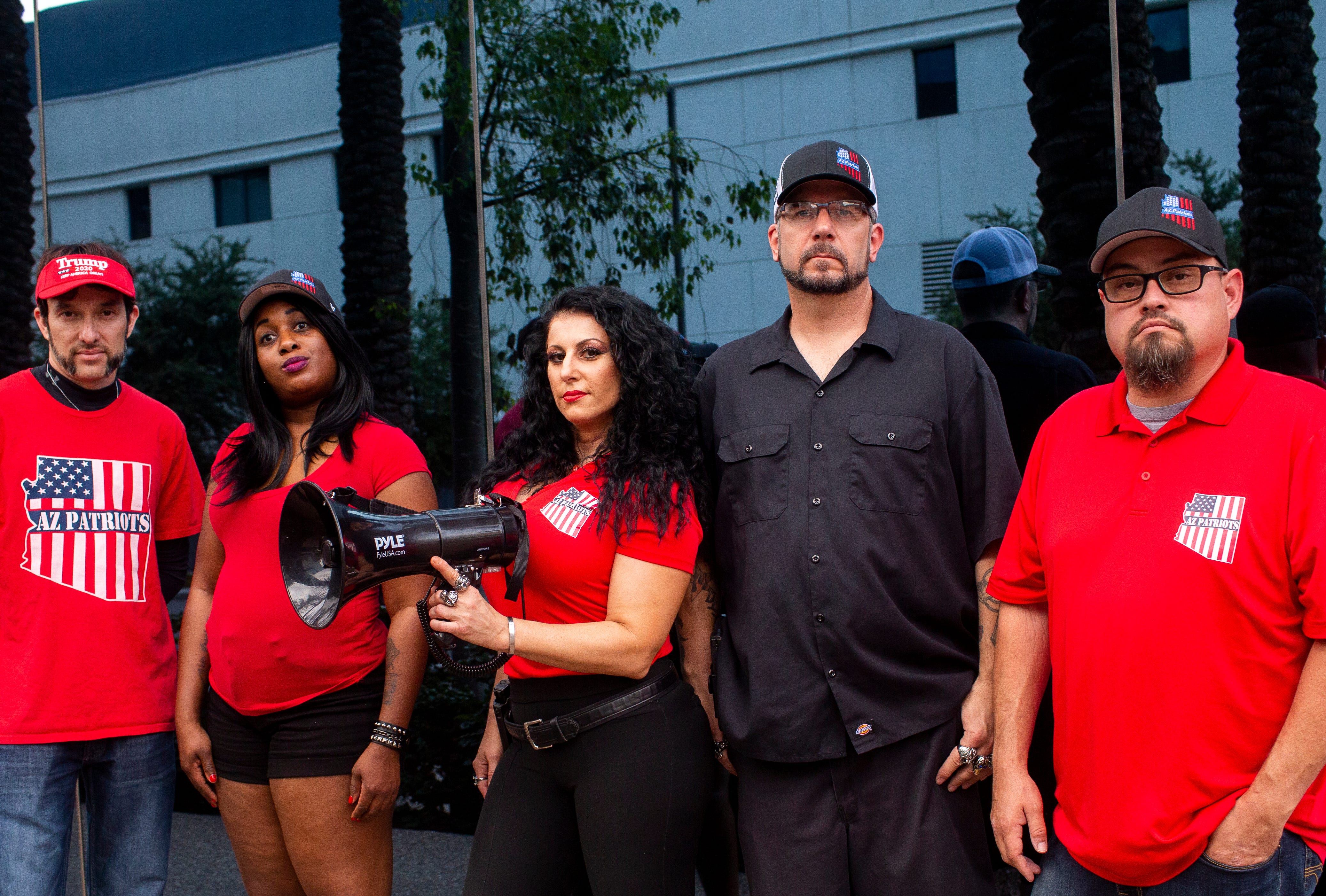 From left to right: AZ Patriots members Eduardo Jaime, Hope Coleman, Jennifer Harrison, Michael Pavlock and Jeremy Bronaugh pose for a portrait in front of The Arizona Republic in Phoenix on June. 24, 2020.