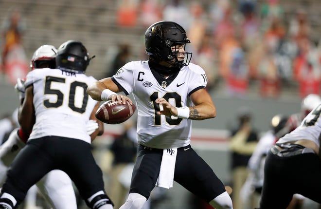 Wake Forest quarterback Sam Hartman (10) prepares to pass during the first half of N.C. State's game against Wake Forest at Carter-Finley Stadium in Raleigh, N.C, Saturday, Sept. 19, 2020.