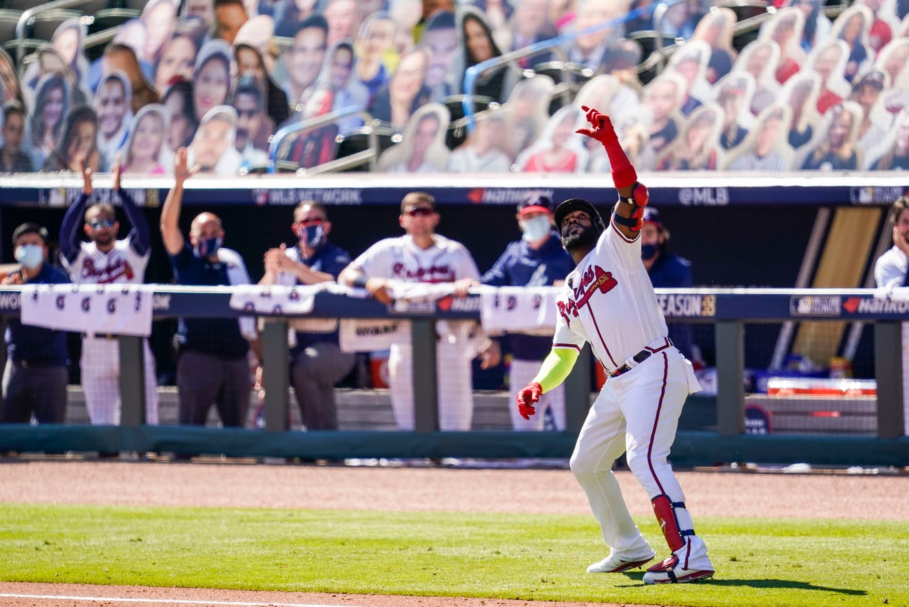 Atlanta Braves designated hitter Marcell Ozuna (20) reacts after hitting a two run home run against the Cincinnati Reds during the eighth inning at Truist Park on Oct. 1.