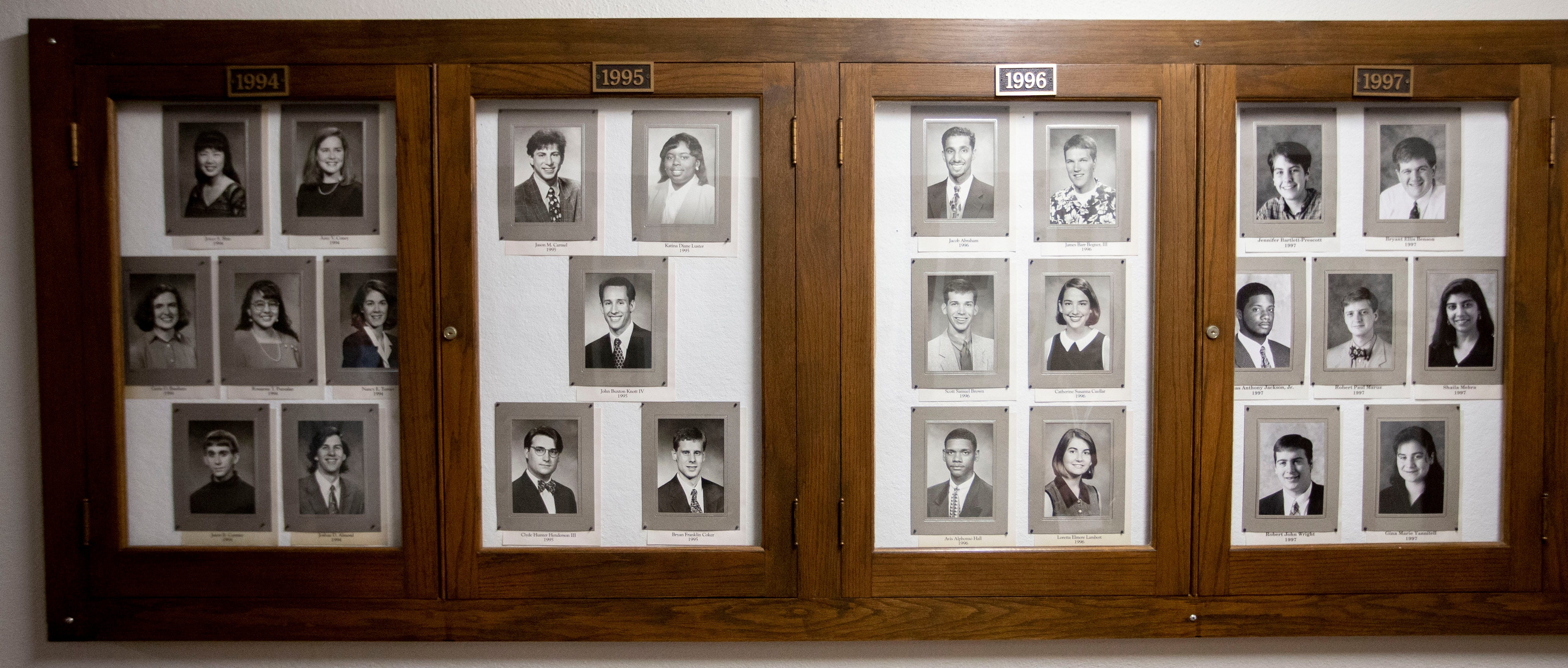 Portraits of Amy Coney Barrett (left frame at the top right) and Robert Marus (right frame in the center), who signed a letter with other alumni opposing Barrett's nomination, hang in a student hall of fame display in Southwestern Hall at Rhodes College.