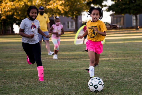 Vanna Heath, right, 7, runs after the ball during a Kickin' It 615 practice at East Park in Nashville, Tenn., Wednesday, Sept. 30, 2020.