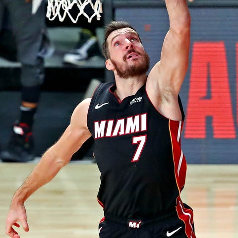 Heat guard Goran Dragic goes up for a layup agains