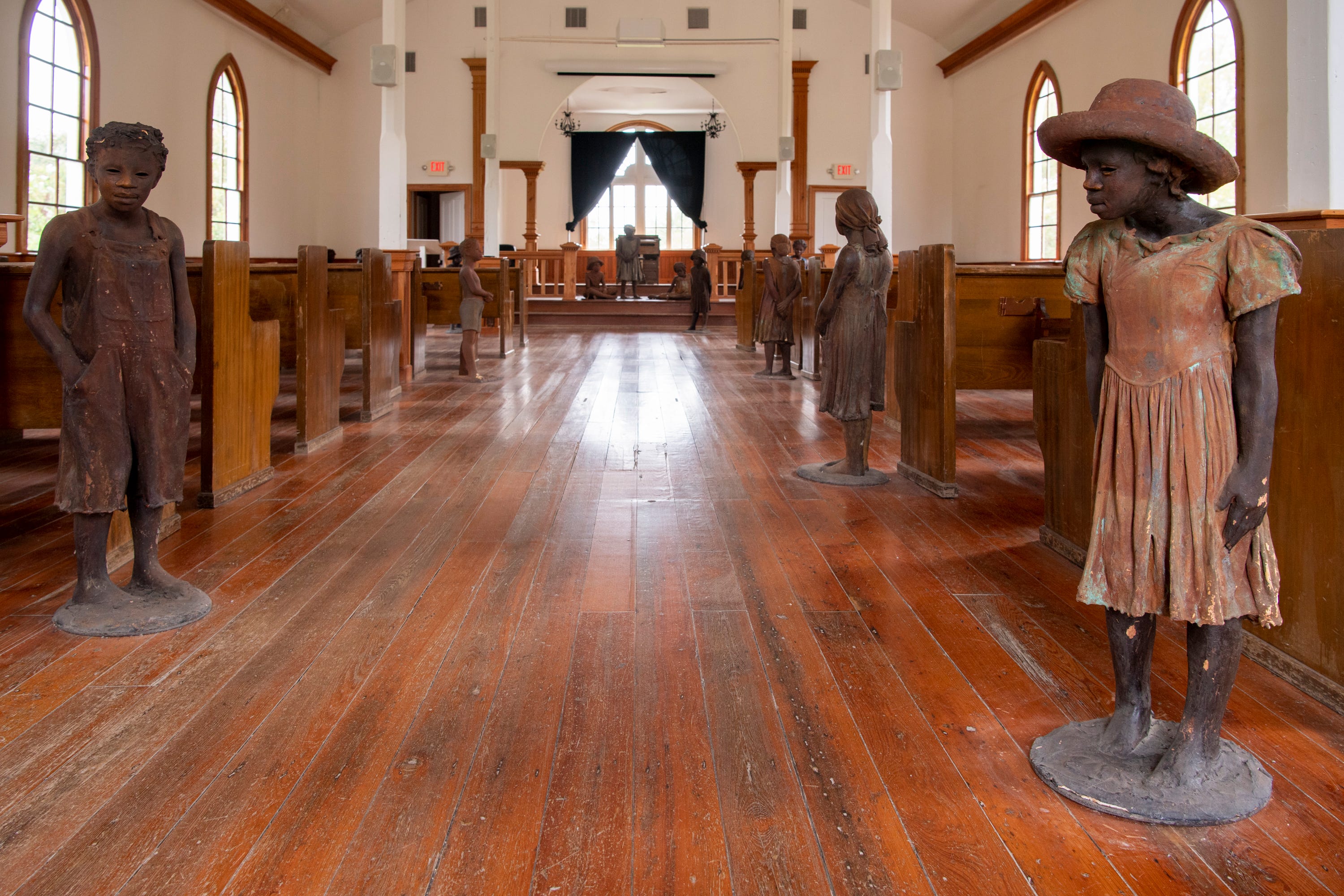 Sculptures of children made by artist Woodrow Nash at the Whitney Plantation Museum, across the Mississippi River from Reserve. 
The sculptures stand throughout the Antioch Church built in 1870 by formerly enslaved people.