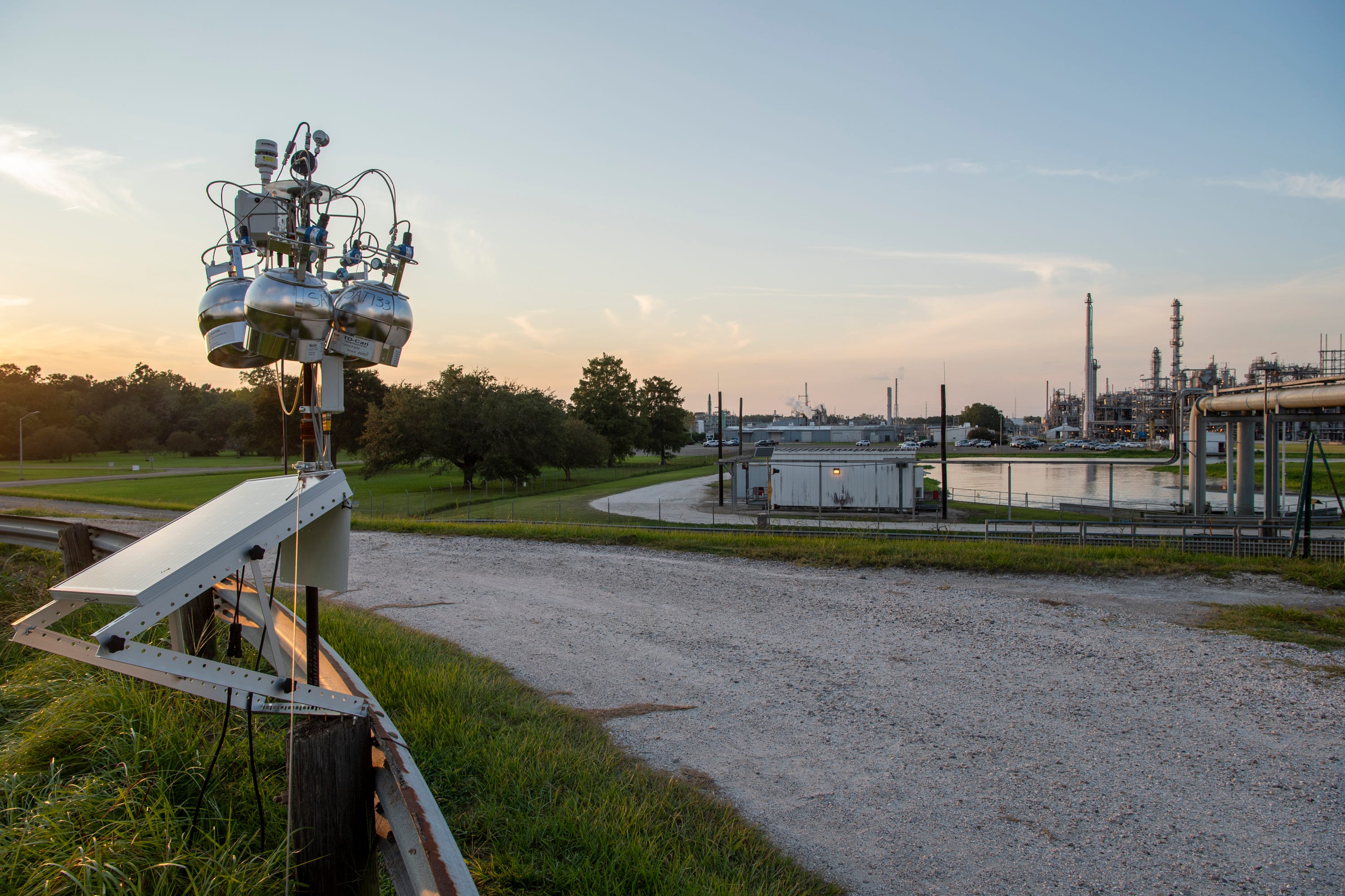 An EPA air monitoring device sits atop a levee across the street from the Denka Performance Elastomer neoprene plant in Reserve, La. The EPA classified chloroprene as a likely carcinogen in 2010 and has been closely monitoring air quality near the plant since 2016.