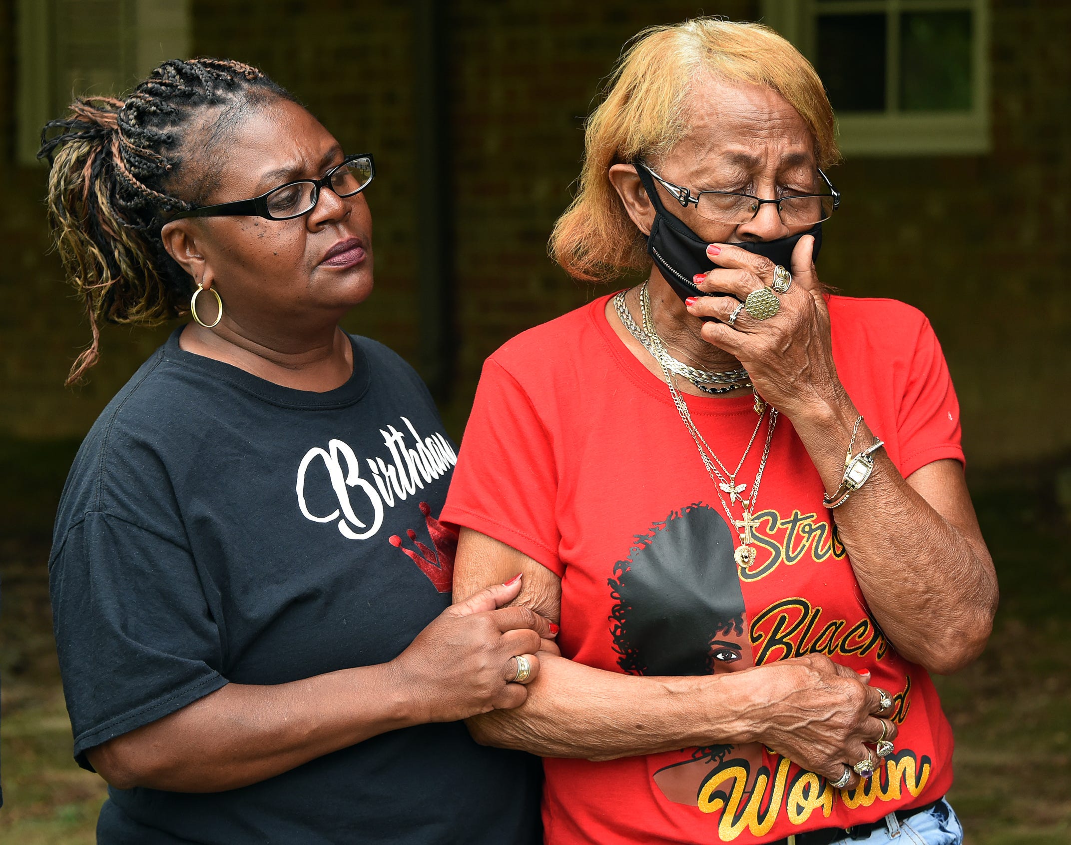 Joseph Pettaway’s sister, Jacqueline, comforts their mother, Lizzie Mae Pettaway. Joseph Pettaway died in July of 2018 at a home in Montgomery, Alabama, after being bitten by a police dog.
