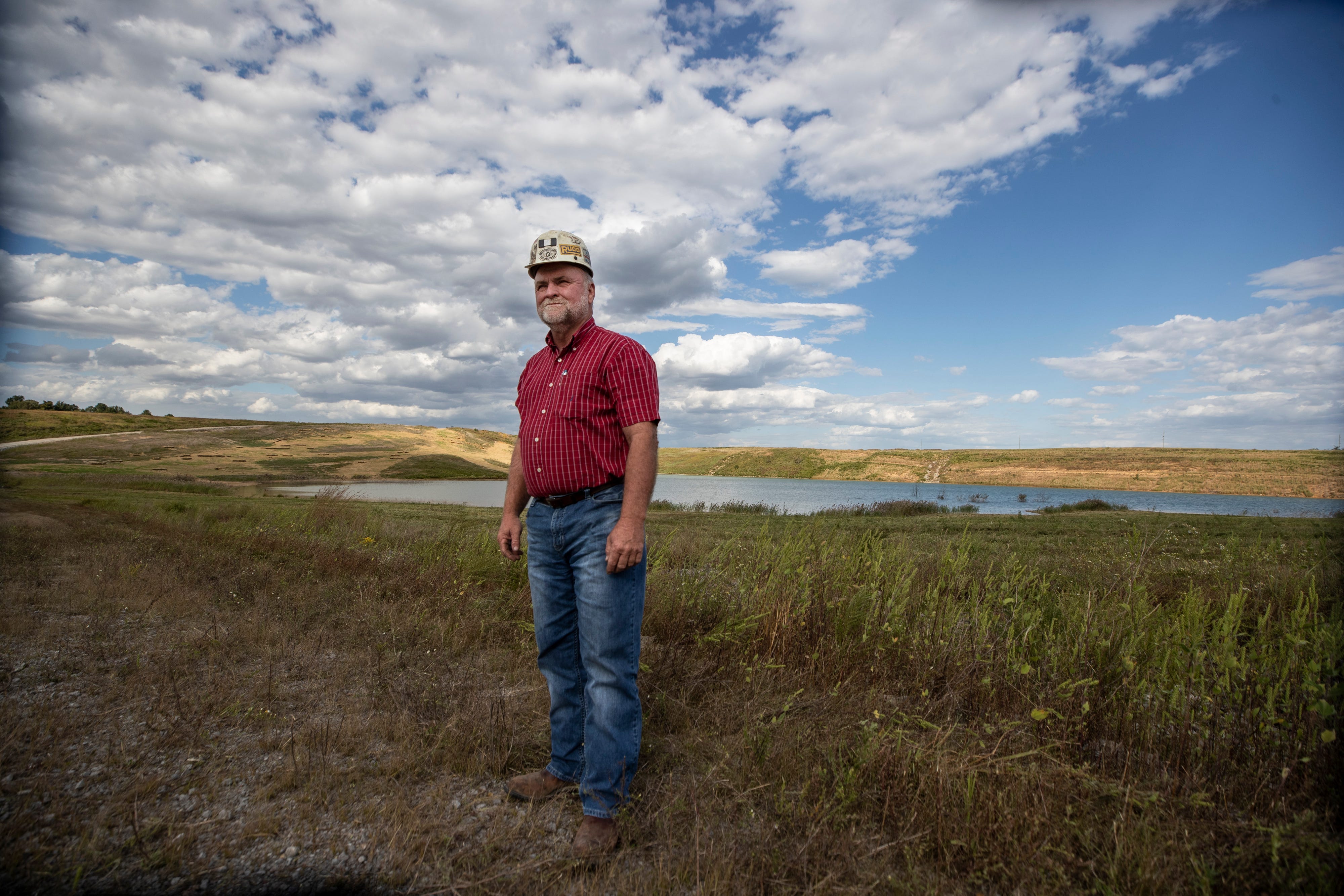 Jon Rogers of the Rogers Brothers Coal Co. stands on the site of a reclaimed strip mine in Muhlenberg County, Kentucky. The land is ready for for commercial development. Oct. 1, 2020