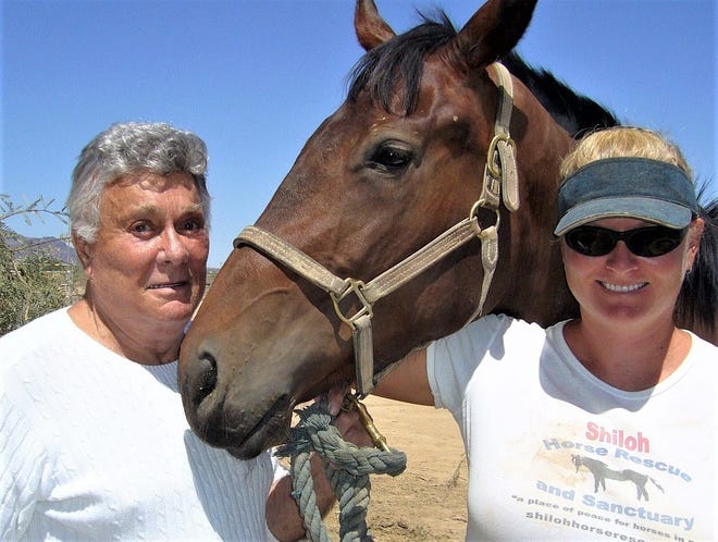 Tony and Jill Curtis in 2006 on their Nevada horse rescue ranch.