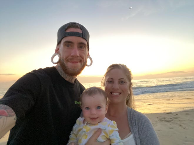 John Wigchert, his partner Amanda Rivkin and daughter, Aubrey, who is 9 months old.