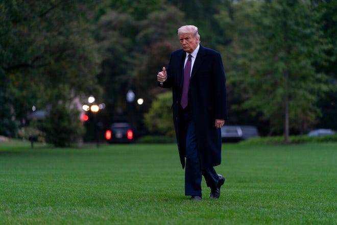 President Donald Trump gives the thumbs-up as he walks from Marine One to the White House in Washington, Thursday, Oct. 1, 2020, as he returns from Bedminster, N.J. (AP Photo/Carolyn Kaster)