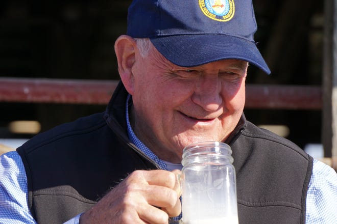 Secretary Perdue drinks a glass of milk after a toast to the dairy industry.