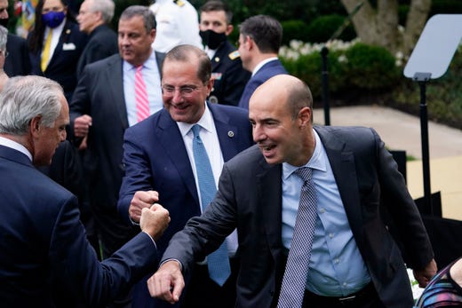 From right, Labor Secretary Eugene Scalia, Health and Human Services Secretary Alex Azar and former New Jersey Gov. Chris Christie greet people after President Donald Trump announced Judge Amy Coney Barrett as his nominee to the Supreme Court, in the Rose Garden at the White House, Sept. 26, 2020, in Washington.