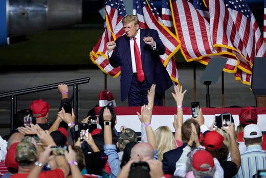 President Donald Trump dances to the song "YMCA" at the end of a campaign rally at Newport News/Williamsburg International Airport on Sept. 25, 2020 in Newport News, Virginia. (Photo by Drew Angerer/Getty Images)