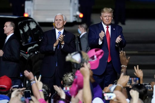 President Donald Trump and Vice President Mike Pence arrive for a campaign rally at Newport News/Williamsburg International Airport on Sept. 25, 2020 in Newport News, Va.