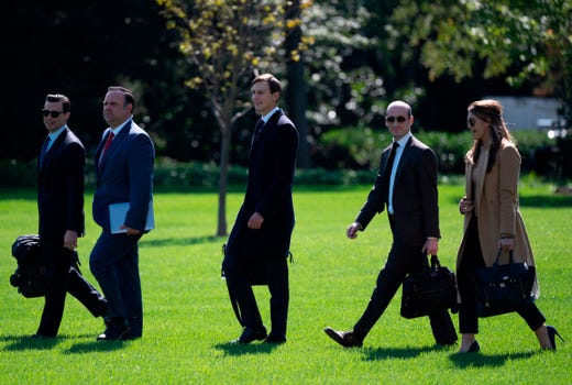 (L-R) Assistant to the President and Director of Oval Office Operations Nicholas Luna, Assistant to the President and Deputy Chief of Staff for Communications Dan Scavino, Senior Advisor to the President of the United States Jared Kushner, Senior Advisor to the President Stephen Miller, and counselor to President Hope Hicks walk to Marine One to depart from the South Lawn of the White House in Washington, DC on Sept. 30, 2020.